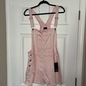 Pink denim overalls